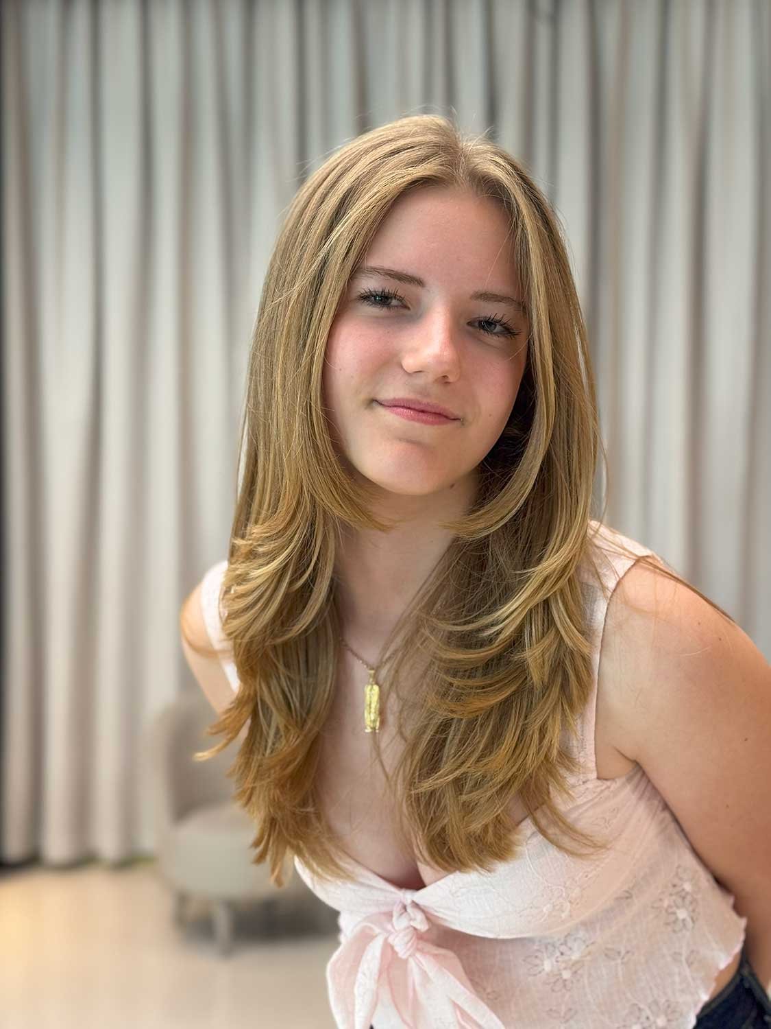 Fresh even colour after root touch-up and toning at Ivy Doha