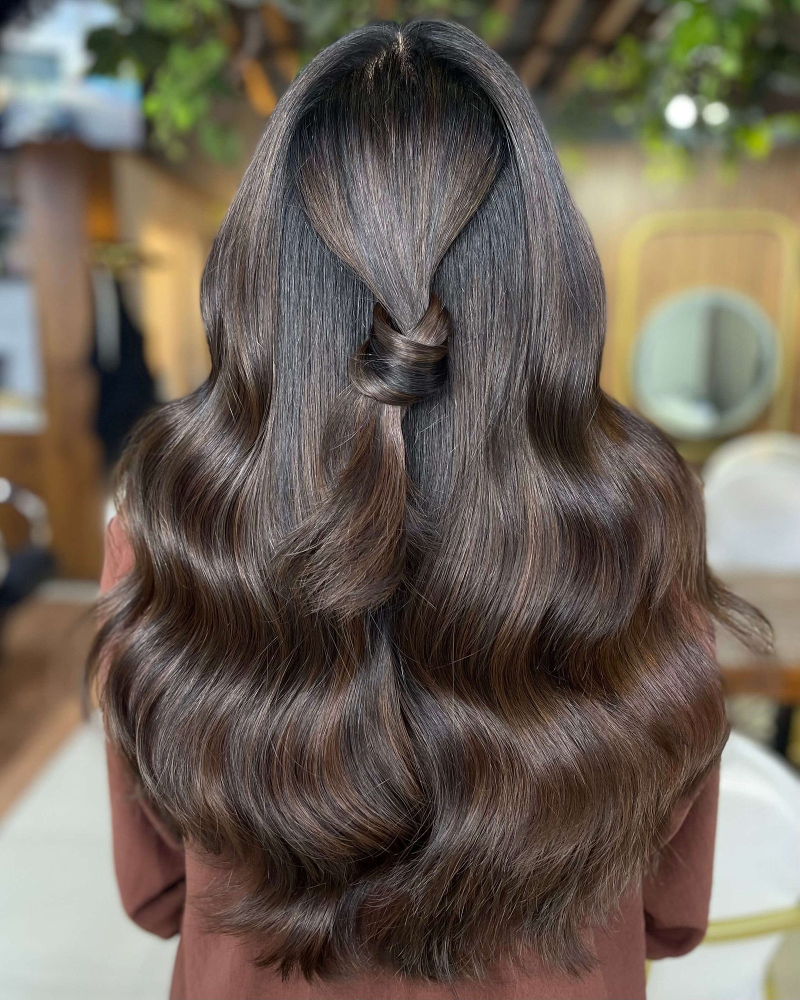 Shiny dark brunette hair colour at Ivy Doha